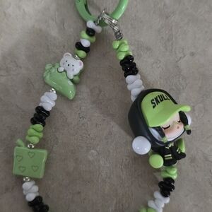 Green and Black Beaded Keychain with Skull Design